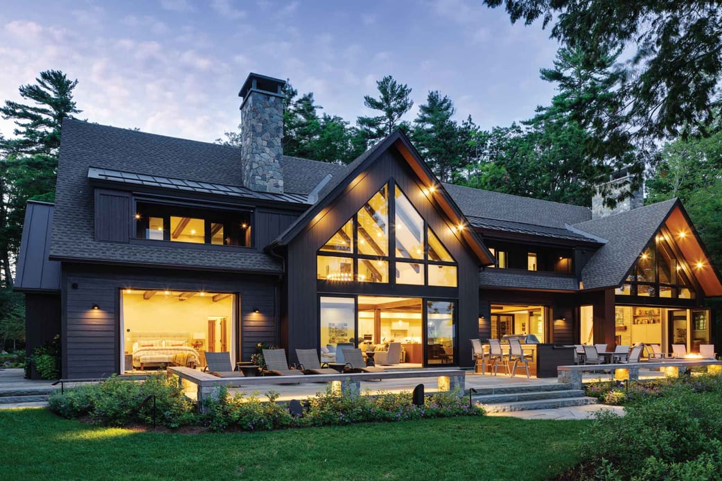 Family Woodland Lakehouse Residential Design Rear Exterior Night 2