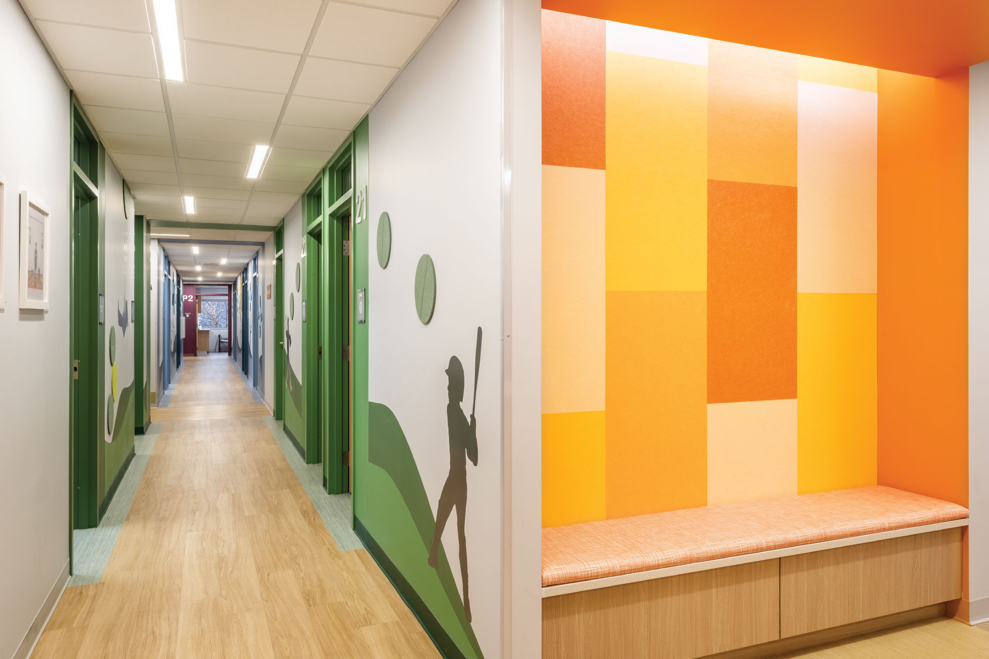 Woburn-Pediatric-Assoc_Psychological-Services-Green-Hall-&-Orange-Seating