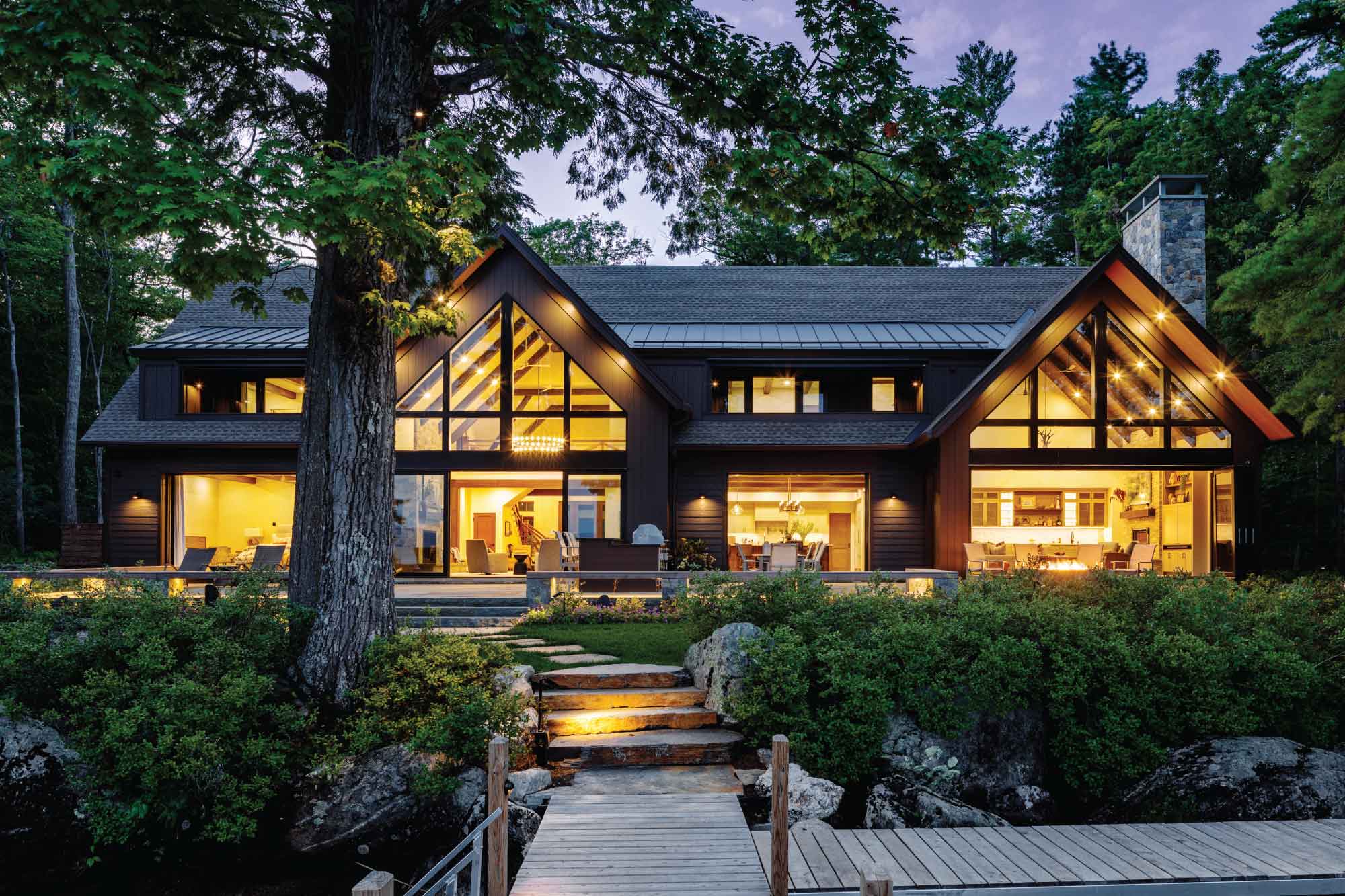 Family Woodland Lakehouse Residential Design Rear Exterior Night